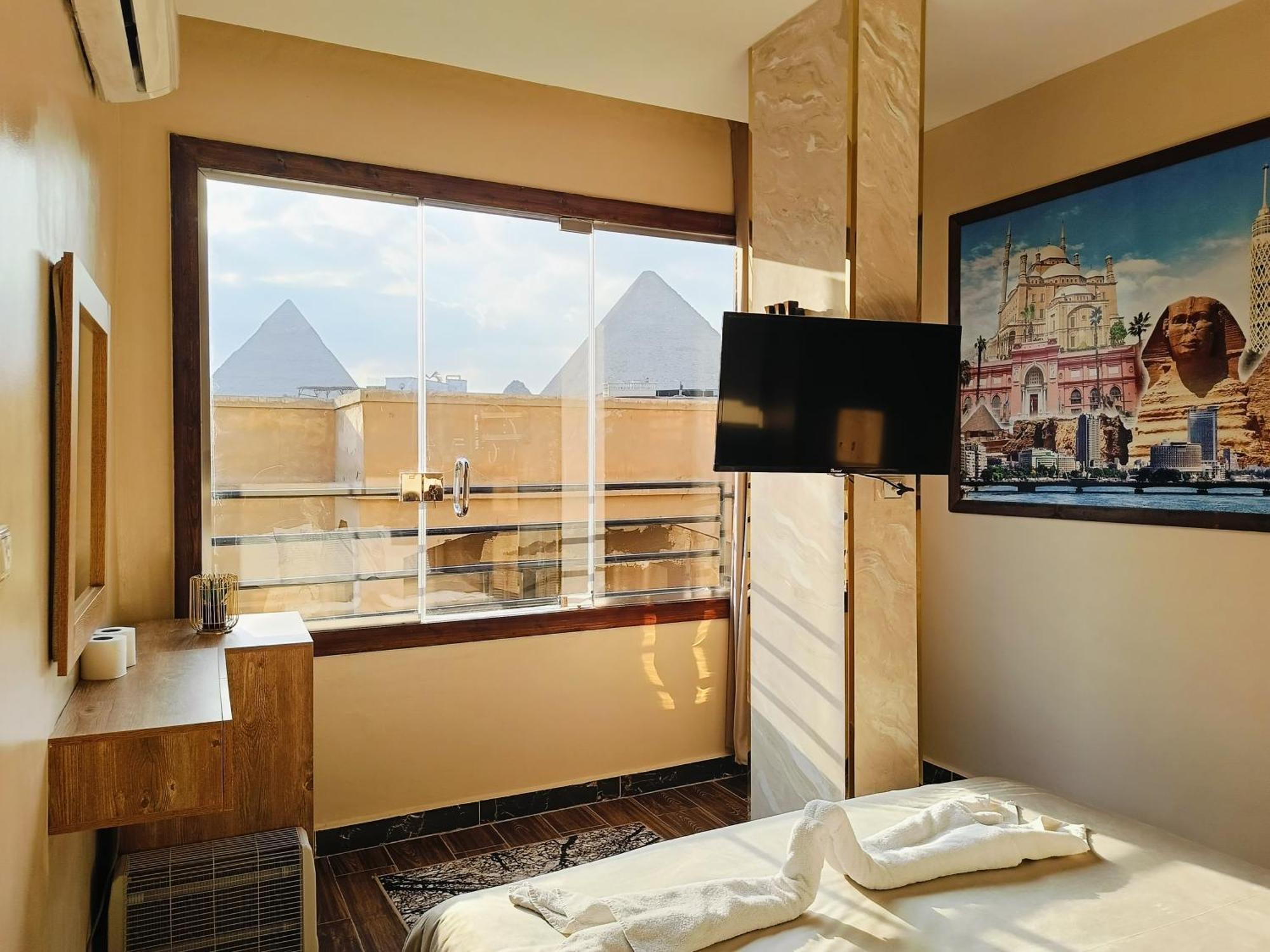 Hotel Magic Golden Pyramids View à Kafret el-Gabal Extérieur photo